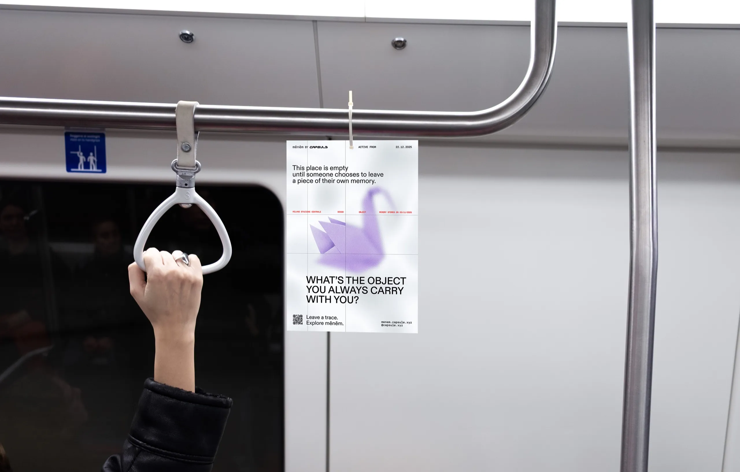 A Capsule flyer hanging in a train carriage, asking What’s the object you always carry with you?